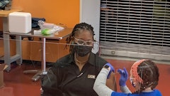 CB ISO Compliance Technician, Evelyn Ruff, receives her first Pfizer vaccination from Coastal Care Partners at JCB’s onsite vaccine clinic.