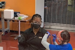 CB ISO Compliance Technician, Evelyn Ruff, receives her first Pfizer vaccination from Coastal Care Partners at JCB’s onsite vaccine clinic.