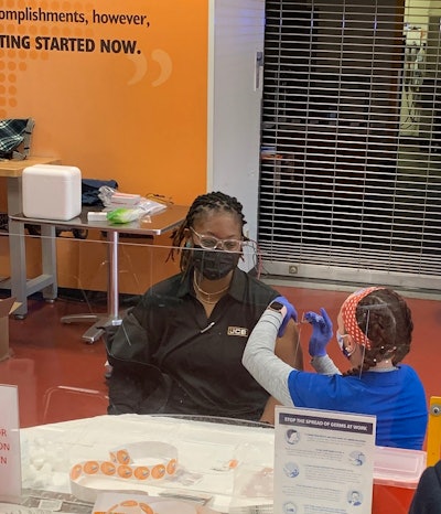 CB ISO Compliance Technician, Evelyn Ruff, receives her first Pfizer vaccination from Coastal Care Partners at JCB’s onsite vaccine clinic.