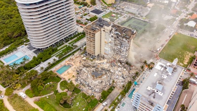 Seen on the left is the 18-story residential building named '87 Park.' A height restriction for Surfside limits buildings to 12 stories, however, 87 Park is just across the border in Miami Beach. According to a June 30 article by Casey Tolan of CNN, residents of Champlain would complain of shaking during the construction of 87 Park. No evidence that the building's construction (2016-2019) contributed to the collapse.