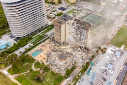 Seen on the left is the 18-story residential building named '87 Park.' A height restriction for Surfside limits buildings to 12 stories, however, 87 Park is just across the border in Miami Beach. According to a June 30 article by Casey Tolan of CNN, residents of Champlain would complain of shaking during the construction of 87 Park. No evidence that the building's construction (2016-2019) contributed to the collapse.