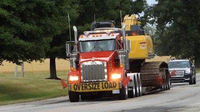 Maintain a four-second interval of clear space between you and the vehicle ahead of you to ensure adequate reaction time and the ability to stop the load.