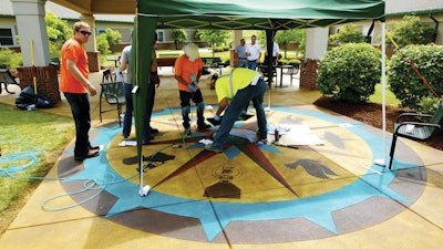 A compass rose emblem depicting military and patriotic icons is a focal point of the decorative concrete work at Ballard Western Kentucky Veterans Center.
