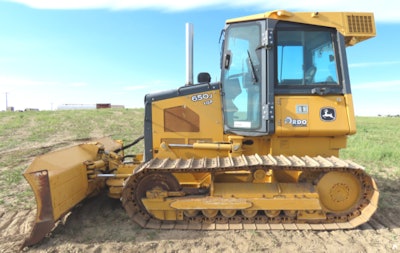 Most manufacturers provide at least two styles of blade mounting. The photo above shows a cabbed-up, low-tracked machine with a C-frame blade mount.