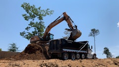 Case 300 excavators fitted with Werk-Brau 54-in. heavy-duty buckets cleared any remaining trees, grubbing them out along with the stumps and root balls left from the logging process.