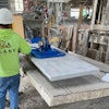 Silverdale Quality Stone coupled a Vacuworx PHD vertical lift mounting assembly with a Caterpillar 262D skid steer loader, using the system to maneuver 1,500-lb limestone slabs in the vertical position