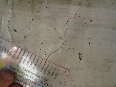 A crack compactor card can help you determine the width of the crack in question. Place the card on the crack and align the line that matches the crack width.