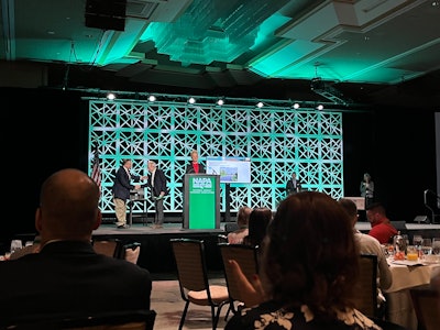 Amy Schwandt, publisher of Asphalt Contractor magazine, presents the 2021 Larry H. Lemon award winners at the NAPA annual meeting.