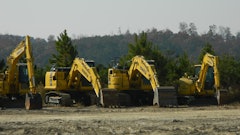 Excavators In A Row
