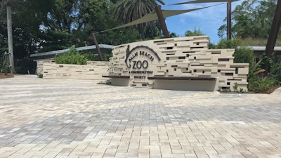 To create the pattern and control water runoff at the same time, Singer Studio chose Eco-Holland permeable pavers in Napoli and Aragon colors from Belgard.