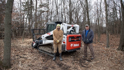 Dan Hansen (right), co-owner of K&D Land Improvement with wife Karen, has his son Zach Hansen (left) working alongside him on jobs.