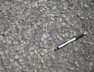 When the aggregate starts to show, this distress is known as raveling and can be addressed with a fog or slurry seal.