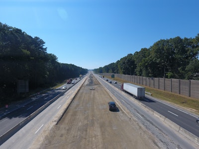 Crews have utilized a temporary access ramp beside the Garner plant that runs from a closed bridge to help bypass traffic and haul asphalt right down into the median. A temporary road built adjacent to the plant provides access to the outside shoulder in the westbound direction. This system will save the team from having to haul approximately 24,500 loads of asphalt in traffic during the project.