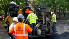 A crew on a parking lot project in Indianapolis prepares to lay asphalt that includes Invigorate Additive.