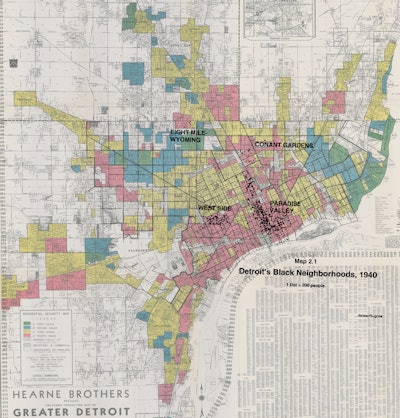 A map that shows in dots the concentrations of African American population in the city, and the lowest rated quality of housing in red.