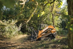 The CASE TV620B tackles a mulching task on soft ground in a heavily wooded area.