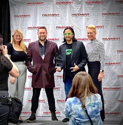 Mark Estrada and Zach Lovett receiving the Good Neighbor Award at NPE 2023.