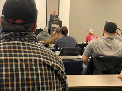 Steve Young, teaching a sealcoating session.