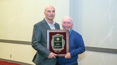 From left: 2022 Lifetime Award winner Gary Brown with 2012 winner Dennis Andrews.