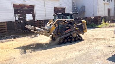 Crews used a 1,925-pound-rated operating capacity ASV MAX-Series RT-65 compact track loader to pry up and haul out floor sections.