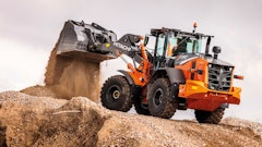 The ZX-7 generation wheel loaders feature a power up mode that increases hill-climbing performance and a large cab with panoramic visibility.