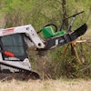 Featuring a 60-in. cutting width, this attachment slices through trees and brush up to 14 in. in diameter, shreds material up to 6 in. in diameter and attaches to most skid steers and compact track loaders.
