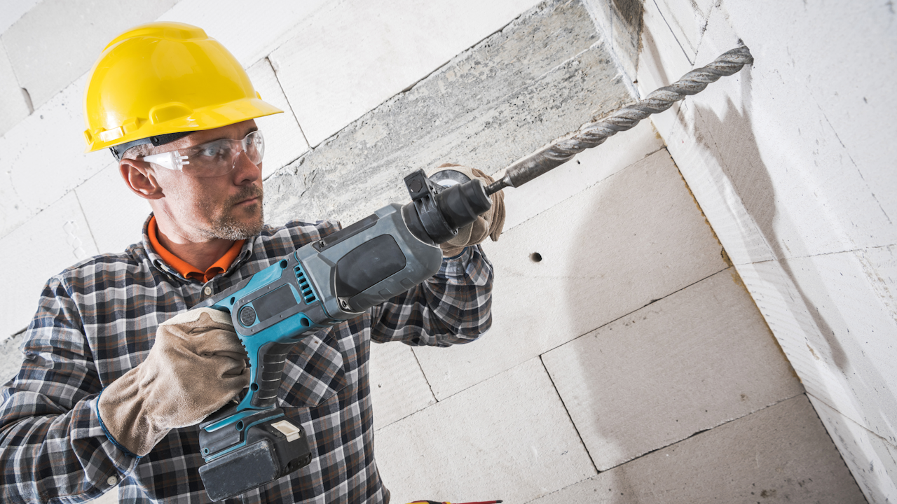 Man With Hammer For Repair Work Stock Photo