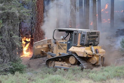 Dozers used in firefighting are being outfitted with guarded lighting, an oil-level sight glass, fuel-shut off in the cab, onboard fire suppression, and pressurized cab systems with HEPA filtration to keep leftover smoke and burnt ash out of the driver’s lungs.