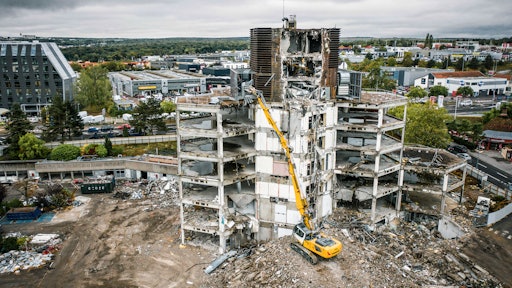 High-reach excavators are often used on deconstruction sites of large industrial plants and city buildings.