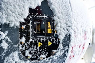 The CiDRA SMARThatch close up on the side of a concrete mixing truck.