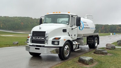 The Mack MD7 truck kitted with a full water tank for dust control, provided by Imperial Industries Inc.
