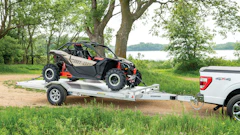 Capable of handling wide body loads, large side-by-sides and UTVs, the trailer has a bed size of 96.875 in. x 179.5 in. with 82.5 in. between the fenders.