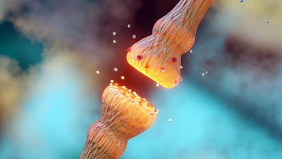 A 3D rendering of neurotransmitters within a body transmitting signals from a neuron to a target cell across a synapse.