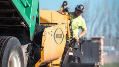 Zach Buck running the paver for Buck Brothers
