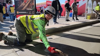 The Steel Edge Women of the Operative Plasterers' and Cement Masons' International Association had a demo of their talent and skill throughout World of Concrete. Here a finisher puts the last few touches to their slab.