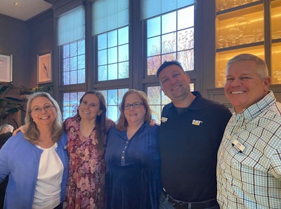 Grabbing a picture with the Caterpillar team at the pre-show dinner