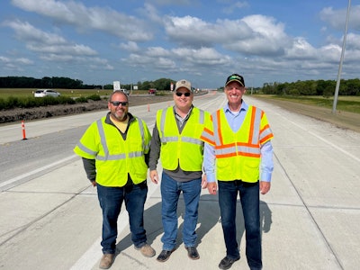 Dennis Howard at the concrete paving site in North Dakota with Northern Improvement Company President Greg McCormick and foreman Ryan Ziegler.
