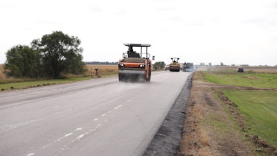 Operators on Hamm rollers ensure compact and smooth roads.