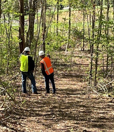 The building is surrounded by a wooded area planned for future outdoor trails.