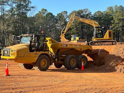One of the skills competitions focused on small hydraulic excavator maneuvers.