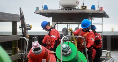 U.S. Coast Guard Aids to Navigation Team (ANT) Baltimore drops buoy channel markers in the Patapsco River in Baltimore, Maryland, April 2, 2024. ANT crews use these buoys to mark the new temporary alternate channel for commercially essential vessels during the Key Bridge Response.