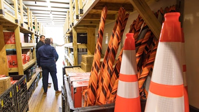 Tempest managers inside one of the Mobile Stores parked at Tempest Storm Rental’s Covington, La., headquarters discuss equipment and gear for line workers to purchase prior to dispatching the vehicle.