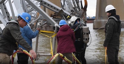 Divers operating with the Key Bridge Response 2024 Unified Command conduct dive operations at the wreckage site of the M/V DALI and the Francis Scott Key Bridge in Baltimore, April 4, 2024. These divers conduct surveys beneath the surface of the water to provide the Unified Command with information on the underwater wreckage.