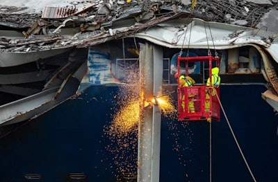 Salvors with the Unified Command continue wreckage removal from the M/V DALI, May 4, 2024, during the Key Bridge Response 2024.