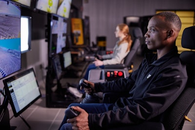 Remote control is also used when performing grading operations under Stage 3 conditions. In this instance, the operator is not on board the vehicle but operating it from a separate location using a joystick or belly box.