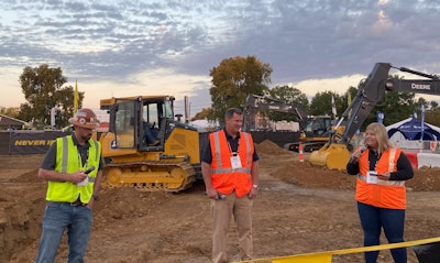 Contractor Thomas Karczmarczyk with the John Deere team during Utility Expo.
