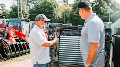 Takeuchi’s Moore employees signed the interior engine cover of the 10,000th CTL, making it a once-in-a-lifetime purchase.