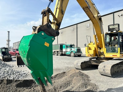 The Reverse V Bucket Attachment has tapered sides to reduce wear on bucket sides and to allow for dumping.