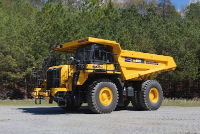 The HD605-10 mechanical haul truck is a 70-ton rigid frame machine designed for reliability and durability.