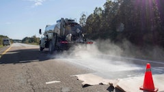 A truck applies Delta Mist being to the NCAT test track. The treated pavement continued to outperform the control surface even 48 months after the initial application.